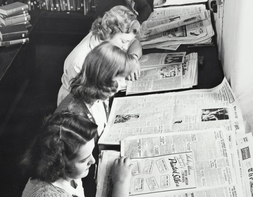 Women Reading a Newspaper