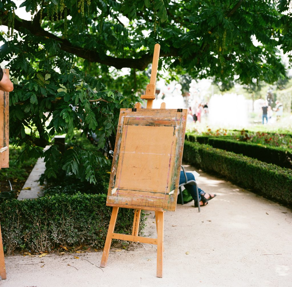 Artist Easel without a canvas outside in a garden